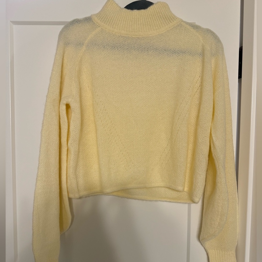 Ivory sweater.